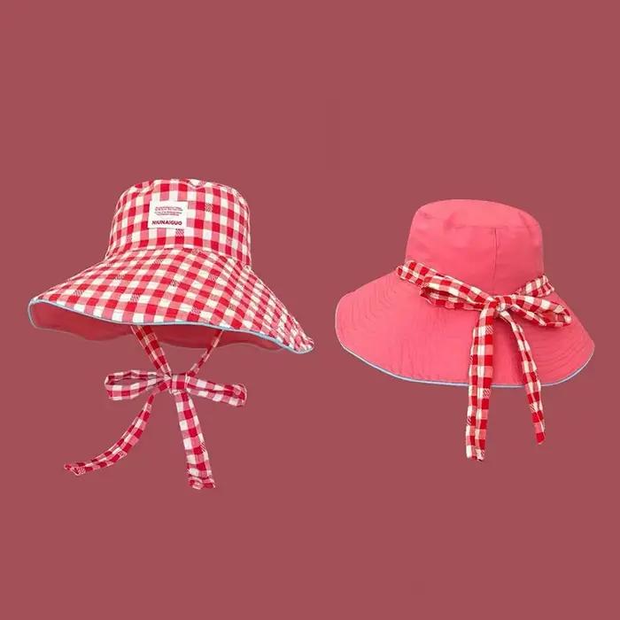 Chapeau seau à carreaux double face pour femme ; Large bord à lacets pour un toucher supplémentaire 