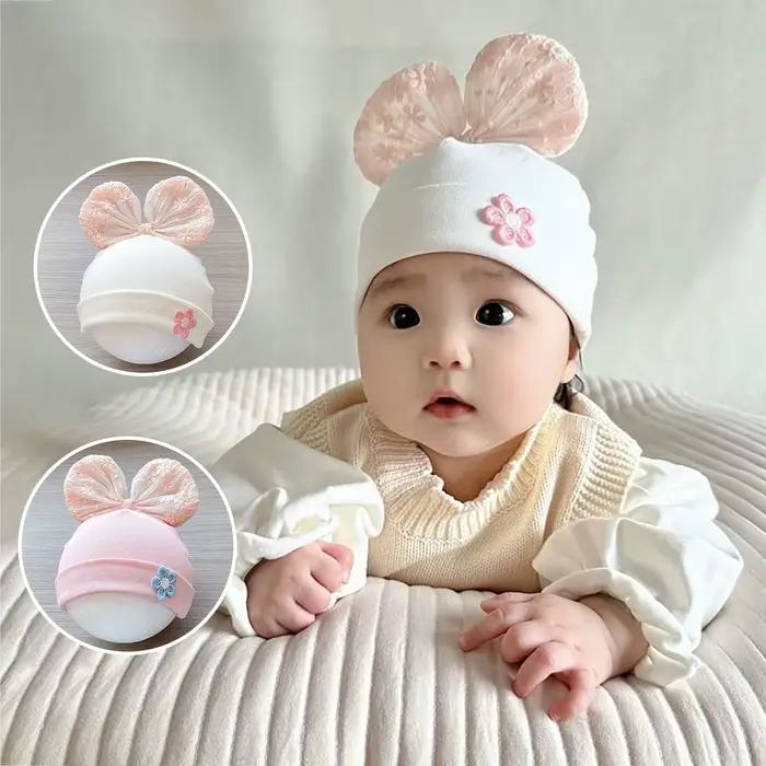 Bonnet nouveau-né en dentelle avec nœud