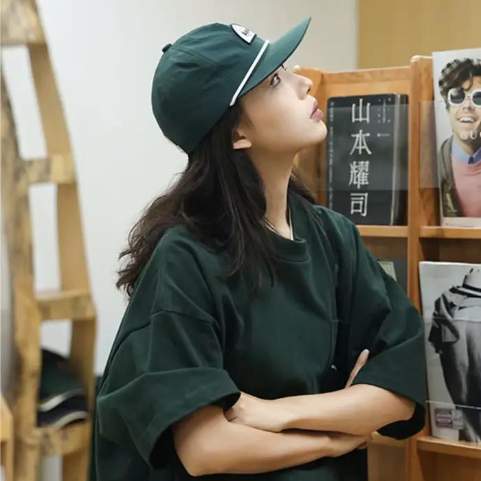 Casquette de baseball unisexe en nylon avec visière souple et design à bouton-pression pour passionnés de hip-hop occasions spéciales et activités extérieures