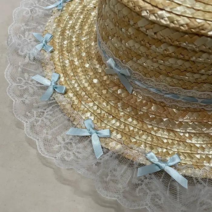 Chapeau de plaisance élégant en dentelle avec nœud plat et large bord pour femmes