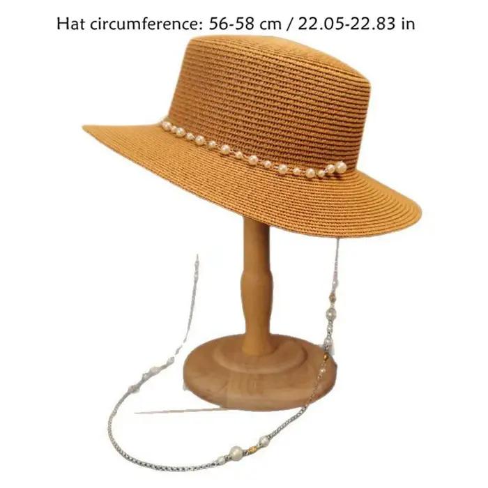Chapeau de paille à large bord avec chaîne de perles coquillages
