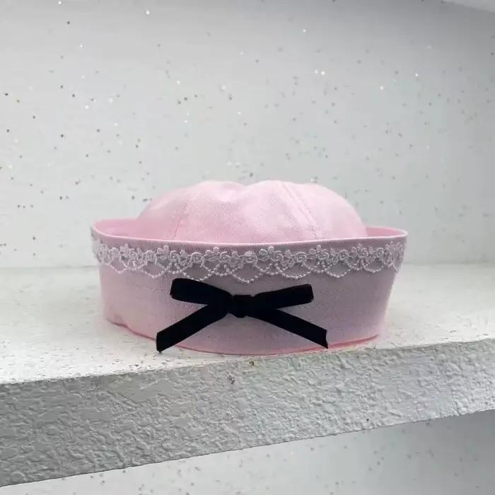 Chapeau de marin rose/blanc/noir pour la plage