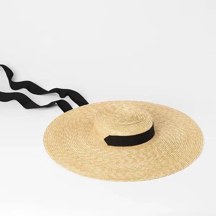 Chapeau d'été en paille à bord de 15cm avec ruban blanc