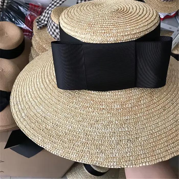 202606-nu Nouveauté chapeau de soleil d'été chic en paille tressée à large bord avec grand nœud