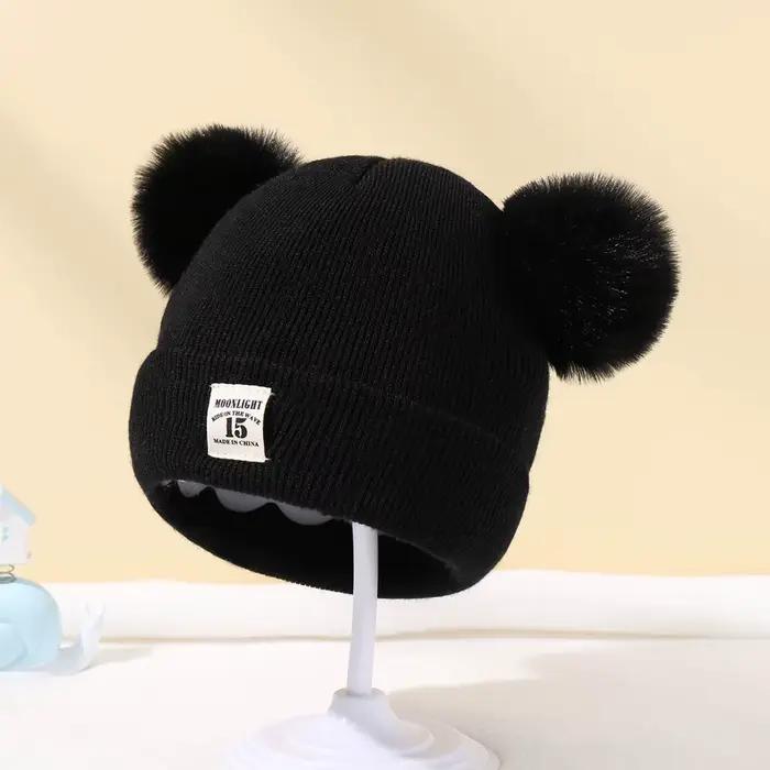 Bonnet tricoté en laine de couleur unie pour nouveau-né