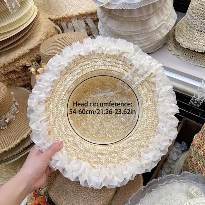 Chapeau de paille à large bord avec nœud en dentelle