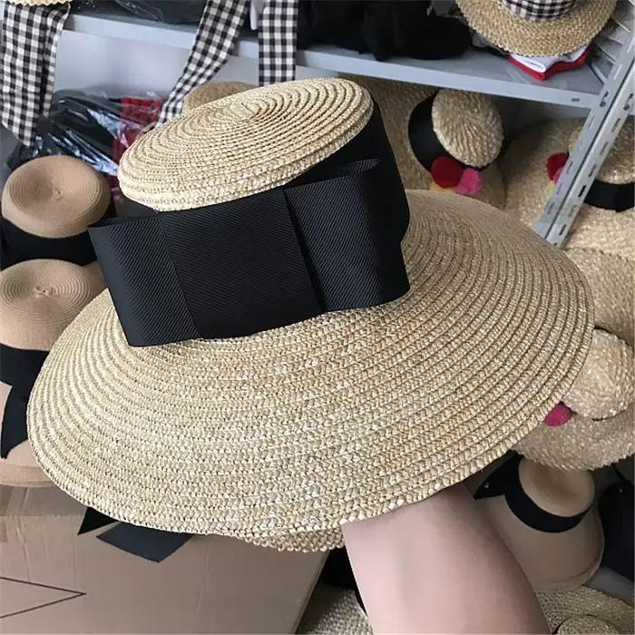 202606-nu Nouveauté chapeau de soleil d'été chic en paille tressée à large bord avec grand nœud