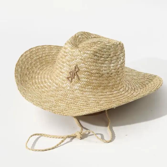Chapeau de cowboy en paille à bord large et courbé