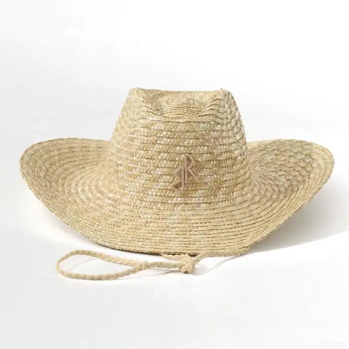 Chapeau de cowboy en paille à bord large et courbé